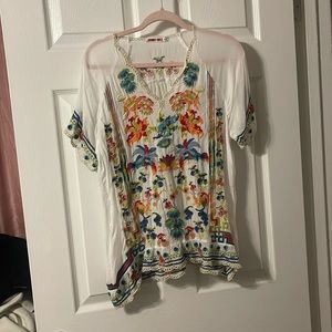 Johnny was embroidered  blouse in size medium gently used